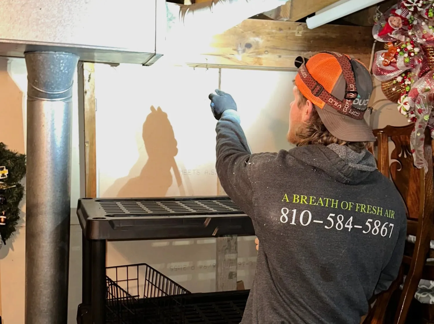 Inspecting basement ductwork in Flushing
