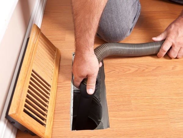 vacuum cleaner to remove all debris from the ductwork